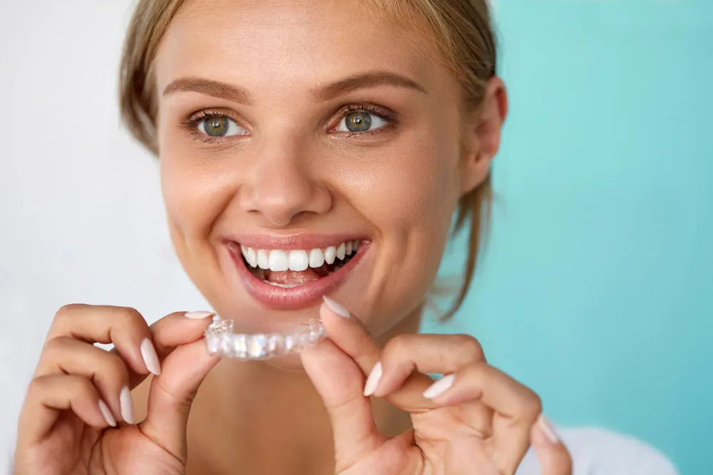 Happy patient using invisalign in Boca Raton. 