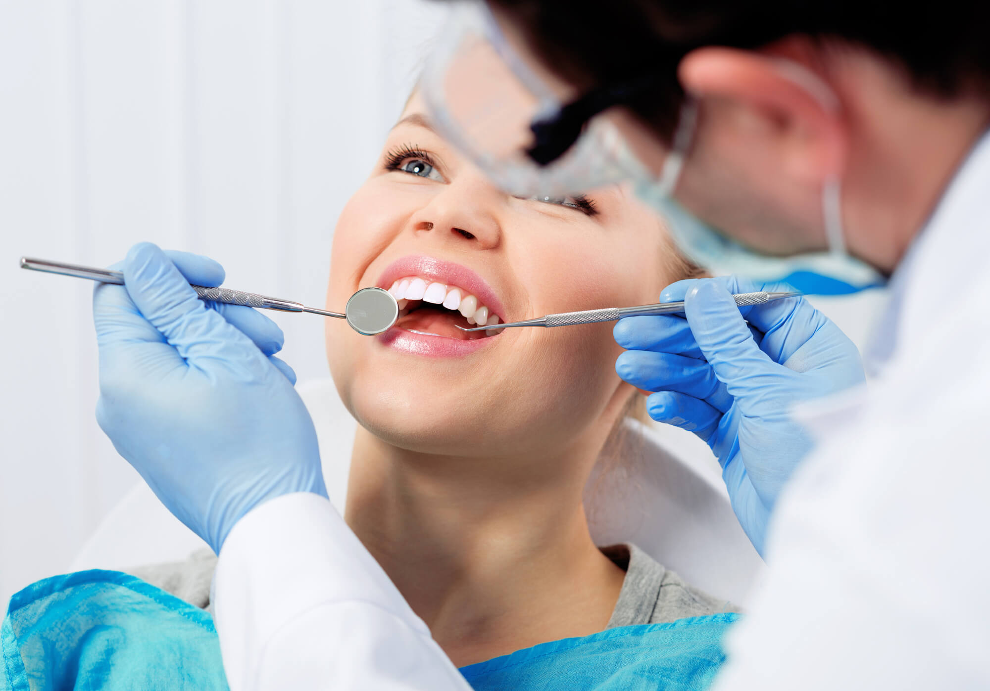 Periodontist in Boca Raton performing an oral exam