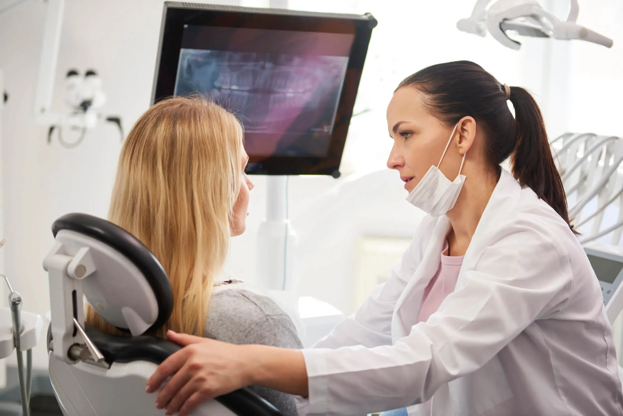 Dentist near FAU talking to patient