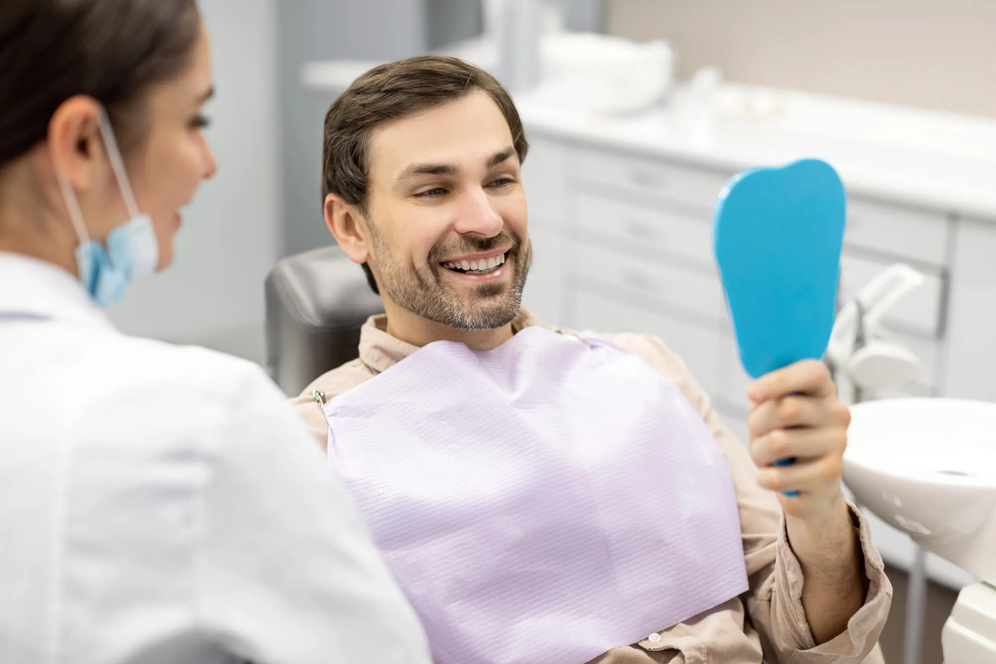prosthodontist 33431 looking at patient